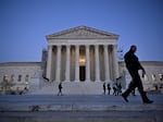 People walk past the U.S. Supreme Court in Washington, D.C., earlier this month.