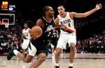 Los Angeles Clippers forward Kawhi Leonard, left, drives against Portland Trail Blazers forward Kris Murray during the second half of an NBA basketball game in Portland, Ore., Friday, March 22, 2024.