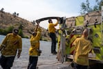 An Oakland Fire Department crew packs up after filling their tank up with water from the Deschutes River at the boat launch in Warm Springs, Ore., on July 28, 2026.