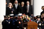 Members of former first lady Rosalynn Carter's family look on as her casket is carried out of Glenn Memorial United Methodist Church following her tribute service on November 28, 2023 in Atlanta, Georgia.