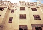 Wooden Frame of Multi-Family Housing Project , depicting Architectural Shapes and Patterns.