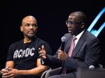 Dr. Olajide Williams (right) was instrumental in creating the "Stroke Ain't No Joke" hip-hop song in collaboration with rapper Doug E. Fresh. He's sitting next to Darryl "DMC" McDaniels of Run-DMC during a panel on hip-hop and public health at the Skoll World Forum.
