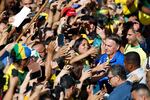 Brazil's former President Jair Bolsonaro (R) greets supporters during a rally on Paulista Avenue in Sao Paulo, Brazil, on June 29.