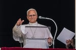 Pope Leo XIV appears at the window of his study in the Apostolic Palace overlooking St. Peter's Square at the Vatican for the traditional noon blessing after praying the Angelus, Sunday, Oct. 18, 2026, a day after he returned from the hospital, where he had lung cancer removed on Tuesday.