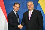 Swedish Prime Minister Ulf Kristersson (left) meets Hungarian counterpart Viktor Orban on Feb. 23, ahead of Monday's key vote in Hungary's parliament on Sweden's bid to join NATO.