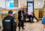 Nolan Levi Strauss is restrained after stabbing Ronnell Hughes in the neck at a truck stop in Ontario, Ore., Dec. 21, 2019. According to court documents Strauss said he did it because he didn't like Black people. Hughes is Black.