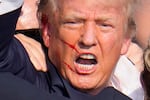 Republican presidential candidate former President Donald Trump reacts following an assassination attempt at a campaign event in Butler, Pa., on Saturday, July 13, 2024.