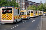 Ambulances drive to the Eduardus Hospital in Cologne-Deutz to evacuate the hospital before specialists defuse three unexploded U.S. bombs from World War II that were unearthed earlier this week in Cologne, Wednesday, June 4, 2025.