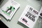 Programs for the Be Nice (White) You're In Bend exhibit on display at Scalehouse in Bend, Ore., on Aug. 6, 2021.