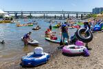 Hundreds of people came to Tom McCall Waterfront Park in downtown Portland to participate in the Big Float, an annual event that aims to raise support for Willamette River preservation. 