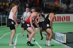 High school students compete in the 4x400 meters relay during the IAAF World Indoor Championships for track and field in Portland on Friday, March 18, 2016.