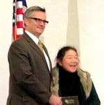 Arlene Kimura, right, receives a Spirit of Portland award from Sam Adams, Nov. 15, 2012.
