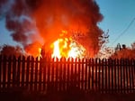 This photo released by Moscow Region Governor Andrei Vorobyev's official telegram channel shows a house on fire after a Ukrainian attack in Khimki, just outside Moscow, Russia, on Sunday, May 17, 2026.