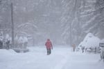 Flurries accumulated on freshly shoveled driveways after a winter storm system hit Bend, February 25, 2019. 