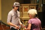 Waller answers a question from a choir member during a break in the rehearsal.