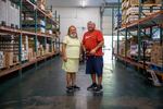 Ina Lane (left) and Dewey Solomon Jr. both help run the Food Distribution Program on Indian Reservations program for the Lummi Tribe.