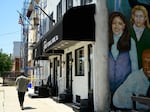 A man walks past Terry Funeral Home, which has served Black families for generations in West Philadelphia.