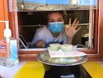 Elaine Escobar works at the Taco City food truck in the Hillsdale food cart pod in Portland, Ore.