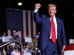 Former President Trump greets supporters during a campaign rally in Las Vegas on Sept. 13, 2024. Trump's proposals such as widespread tariffs could spark more inflation.