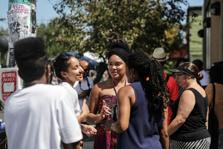 Members of the Black United Fund chatted outside the entrance to the organization.
