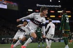 Vancouver Whitecaps midfielder Ryan Gauld scores a goal during the first half of an MLS soccer match against the Portland Timbers Wednesday, Oct. 23, 2024, in Portland, Ore.