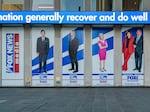 Among the stars being questioned under oath for Dominion Voting Systems' defamation suit against Fox News are Tucker Carlson, Sean Hannity and Maria Bartiromo. Banners bearing their images hang from Fox Corp headquarters in New York City, first, second and fourth from left, respectively.