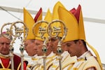 Newly consecrated Bishops, from left, Pascal Schreiber, Michael Goldade, Michel Poinsinet de Sivry and Marc Hanappier, wearing their miters and holding their pastoral staffs, pray at the end of their consecration ceremony in a tent set up outside the Society of St. Pius X seminary in Econe, Switzerland, Wednesday, July 1, 2026.