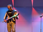 Chet Udell plays the Optron on January 19, 2026. The Optron is a unique instrument developed by Udell described as if “a lightsaber and a guitar had a baby”.
