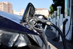 PASADENA, CALIFORNIA - SEPTEMBER 23: A Nissan LEAF electric vehicle (EV) recharges at a charging station on Sept. 23, 2024 in Pasadena, Calif. 