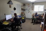 Mosier Fire District Captain Connor McKibben, left, and firefighter Kikyo Hawkins work in the Mosier Fire District office on July 13, 2026 in Mosier, Ore. 