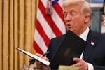 President Donald Trump pictured signing executive orders at the White House on Monday.