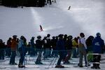 Skiers and snowboarders finish runs at Mt. Bachelor ski resort outside Bend, Ore., Monday, Dec. 7, 2020. Mt. Bachelor opened its winter ski season with new restrictions to limit the spread of coronavirus.