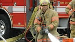 Firefighters with Portland Fire and Rescue demonstrate how they would apply fire retardant foam to contain and extinguish an oil train fire. 