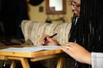 Skyler Brown-Evans fills out her ballot on Thursday Oct., 24, 2024 in Bend, Ore.