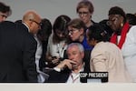 André Corrêa do Lago, COP30 president, sits as Simon Stiell, United Nations climate chief, left, speaks with other U.N. officials during a plenary session at the COP30 U.N. Climate Summit, Saturday, Nov. 22, 2025, in Belem, Brazil.