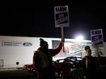 Workers form a picket line outside the Ford Motor Co. Kentucky Truck Plant in the early morning hours on October 12, 2023 in Louisville, Kentucky. This week, a majority of workers at the plant voted no on the tentative contract deal.