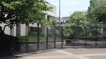 Temporary fencing, as seen in this May 1, 2026 photo, surrounds much of the Eugene federal building, blocking off access to a courtyard where protestors gathered during a Jan. 30 protest that was declared a riot after windows were broken. A federal judge said Monday, June 22, ordered the fence to be removed.