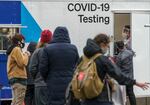 Over 50 people were waiting in line for a COVID-19 test at the Oregon Convention Center testing site operated by Curative, Jan. 6, 2022. A staff member told people in line that the wait was 45-60 minutes. Getting access to tests has become increasingly challenging.