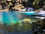 FILE - The photogenic Blue Pool on the McKenzie River has become very popular in the Instagram era. But the cliffs around the pool rise between 10 and 60 feet, and the water averages 37 degrees — cold enough to cause immediate physical shock.