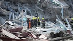 Rescuers work at the site of a high-rise building under construction that collapsed after a 7.7 magnitude earthquake in Bangkok, Thailand on Friday.