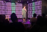Teacher-comedian Hannah G performs stand-up at the Infinity Room in Salem, Ore., on Oct. 7, 2023. She works as an elementary school special education teacher in Boring, Ore.