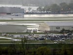 Severe weather damage to Eppley Airfield in Omaha, Neb., can be seen from the Lewis and Clark Monument in Council Bluffs, Iowa, Friday, April 26, 2024.