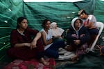 Erbeen and her family gather in an enclosed space at her grandfather's farm, where they have been sleeping since the quake hit.