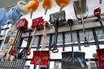 Snow shovels hang behind the register at Hankins Hardware store on Feb. 18, 2026 in Portland, Ore.