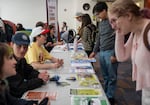 Portland State University Students and volunteers with the League of Women Voters of Portland help students at the voter registration table at Portland State University on Oct. 6, 2026.