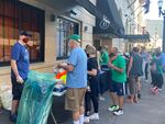 Volunteers check-in for a downtown clean-up event on Thursday, Sept. 3, 2020, in Portland, Ore.