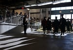 Students file into the Oregon State Fairgrounds Pavilion in Salem on Friday, June 7, 2024, for the McKay High School graduation ceremony.