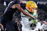 FILE - Oregon defensive back Dakoda Fields, right, comes down with an interception during the second half of an NCAA college football game against Purdue in West Lafayette, Ind., Oct. 18, 2024.