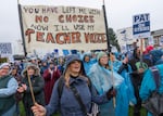 FILE - Teacher Melanie Hindman, center, uses her “teacher voice” as she cheers at a Portland Association of Teachers rally held at Roosevelt High School in Portland, Ore., Nov. 1, 2023. Hindman teaches French at Lincoln High School in Portland.