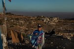 Aadaysit, Lebanon. Sept. 26. Portrait of Abbas Jumma at his destroyed home. He chose to return to the ruins and reopen a carpentry workshop, spending his days working , and even dancing among the devastation. Diego Ibarra Sánchez for NPR